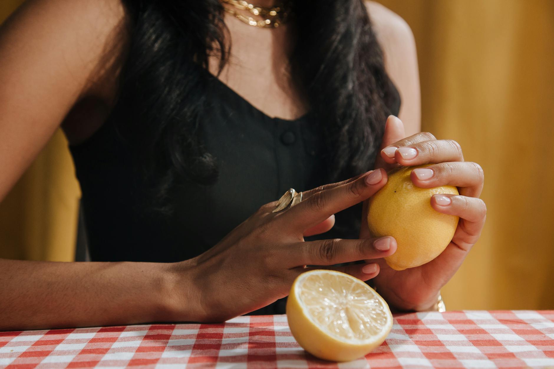 Woman holding a fresh lemon, representing the quest to restore sensation and pleasure while on antidepressants