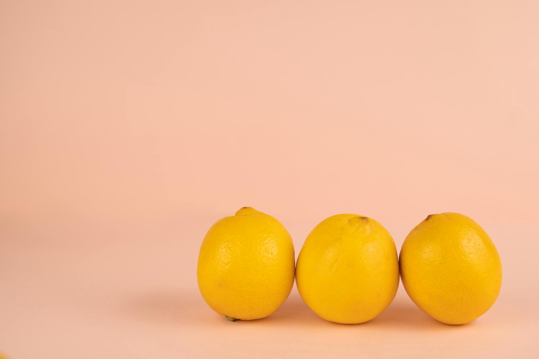 Bright lemons on a pastel background symbolizing renewal and fresh starts